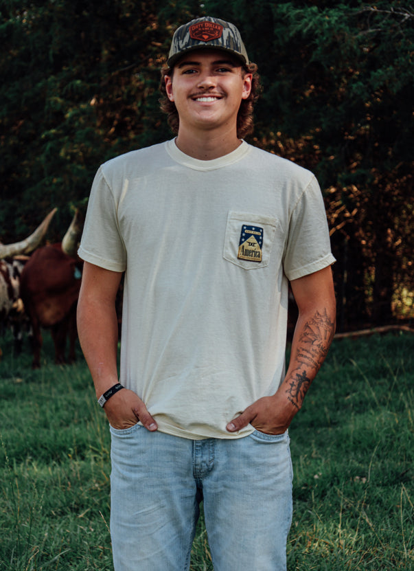 Ivory Comfort Colors Dirty Dollar Ranch Flag Pocket Short Sleeve Tee